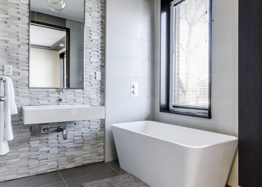 Stone wall and white bath