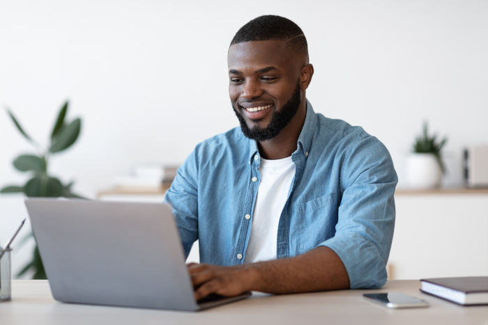 Man checking his Booking.com fees for the month