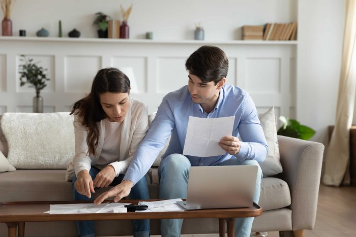 Two people concentrating on work