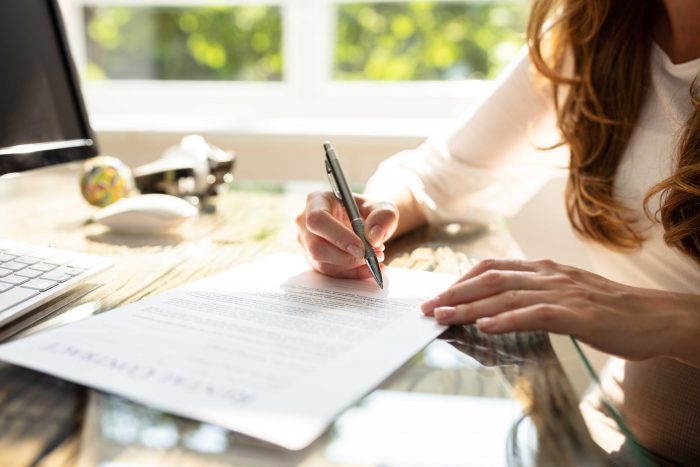 A host signing a vacation rental cleaning contract