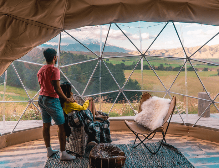 A couple enjoying their vacation at a glamping business