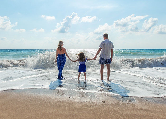 A family enjoying a beach house vacation