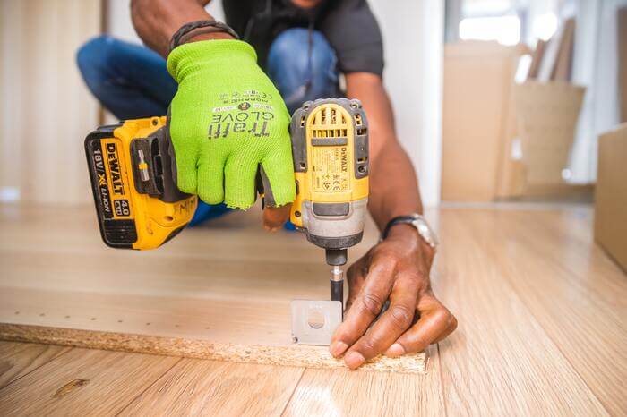 A host fixing property himself as part of DIY rental property maintenance