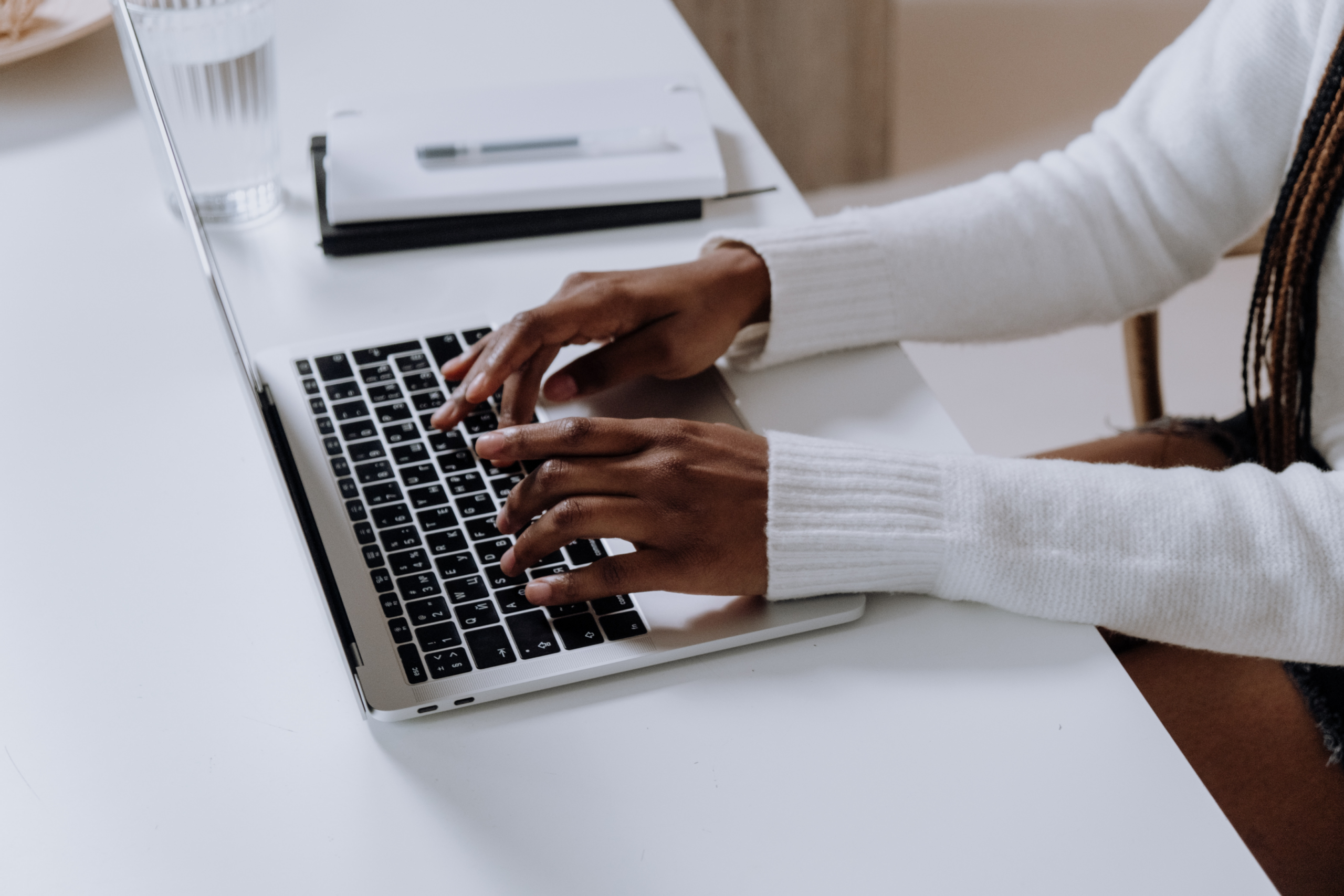 Woman typing on laptop