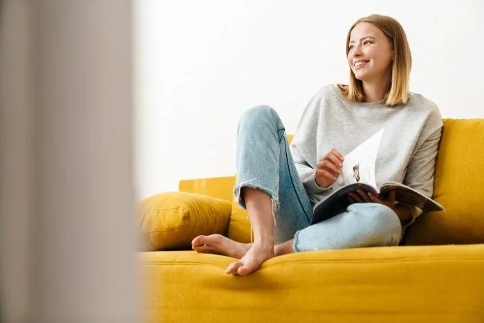 Woman reading an Airbnb house manual template